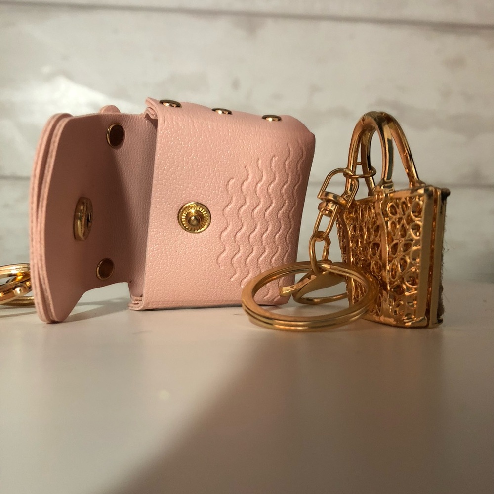 Group of four keychains or/and purse charms.